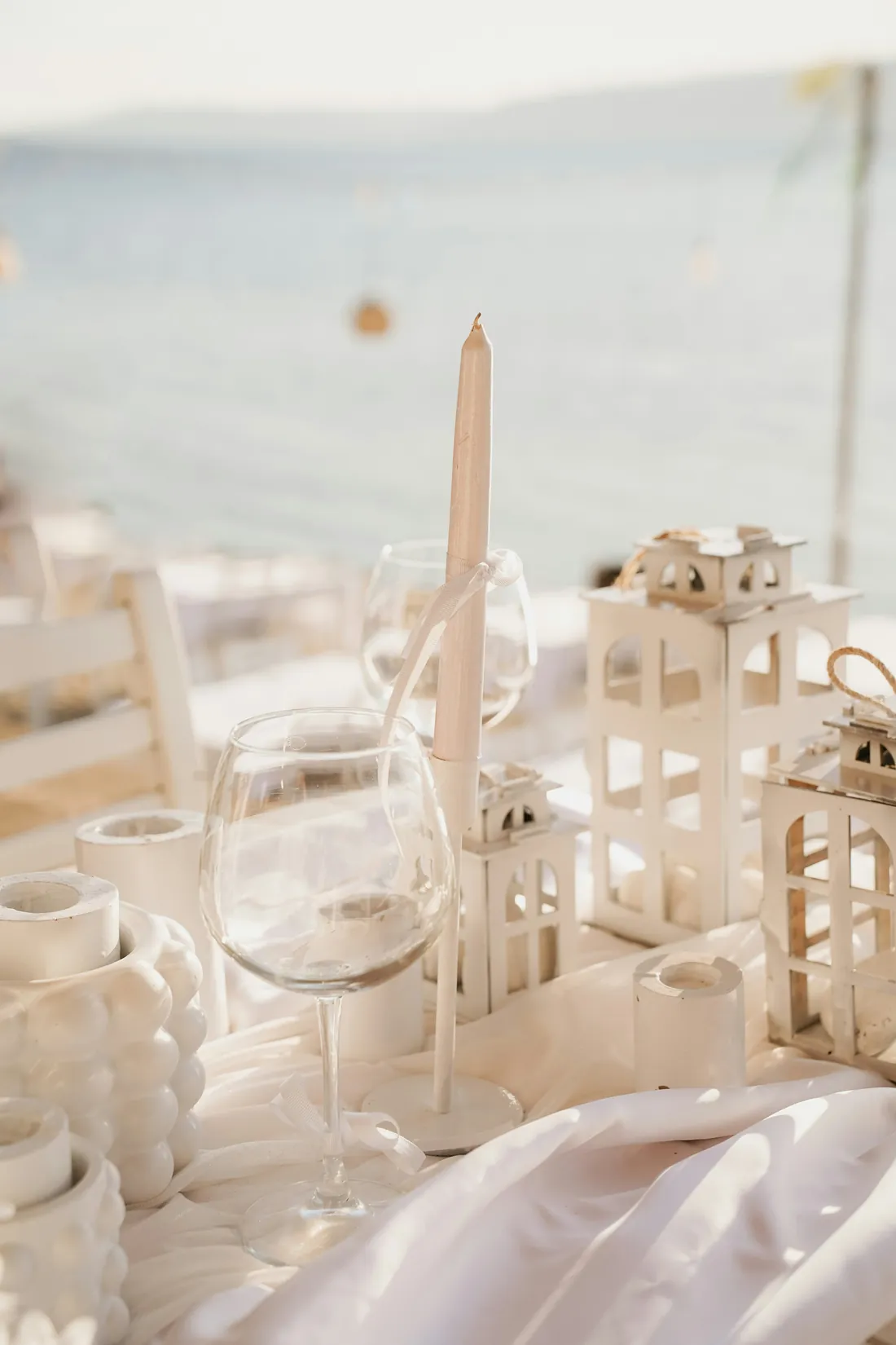 Candles and lanterns on a table set for two