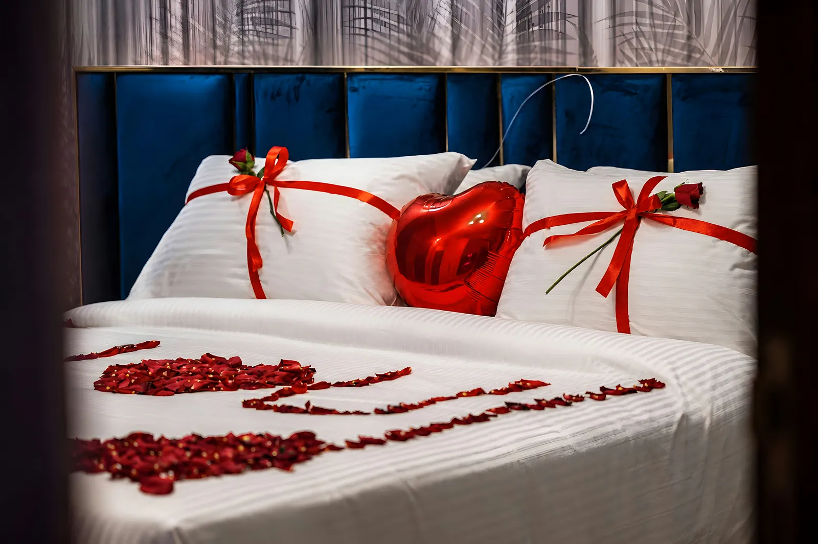 A room set up with rose petals