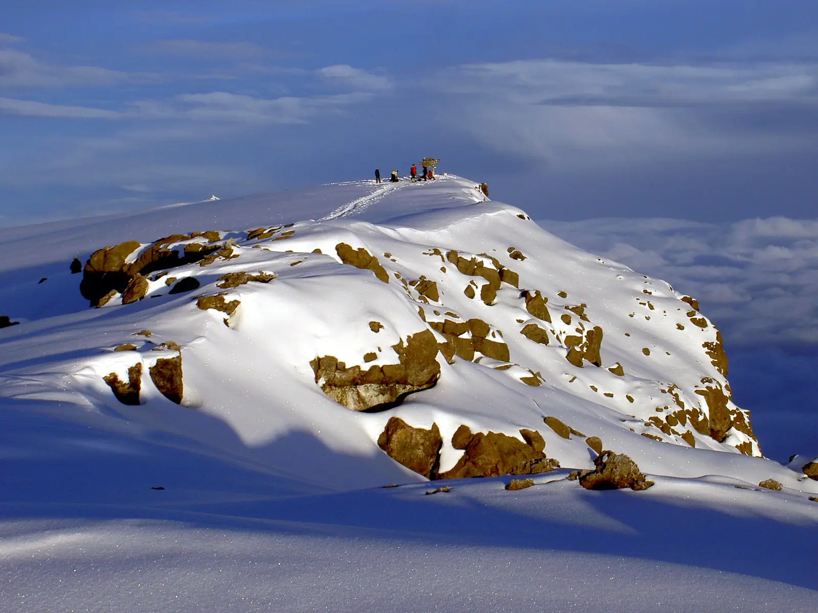 Climbers near the summit above the clouds